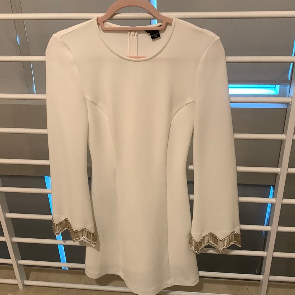 Beautiful Marciano white dress with luxury ends in hands